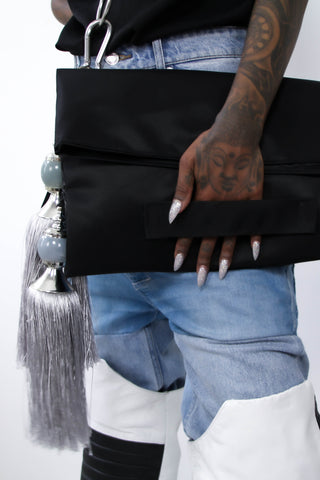 Shop Emerging Contemporary Womenswear brand Too Damn Expensive Tassel Clutch Bag at Erebus
