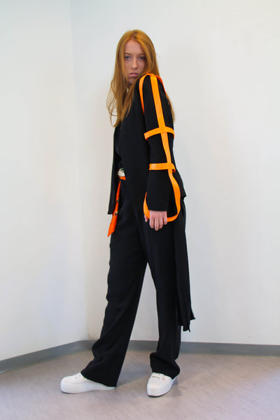 Shop Emerging Contemporary Womenswear brand Too Damn Expensive Black Strap Blazer with Orange Strap Details at Erebus