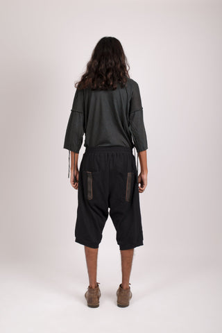 Shop emerging dark alternative conscious fashion genderless brand Anoir by Amal Kiran Jana Black Organic Cotton with Reclaimed Leather Detail Loki Shorts at Erebus