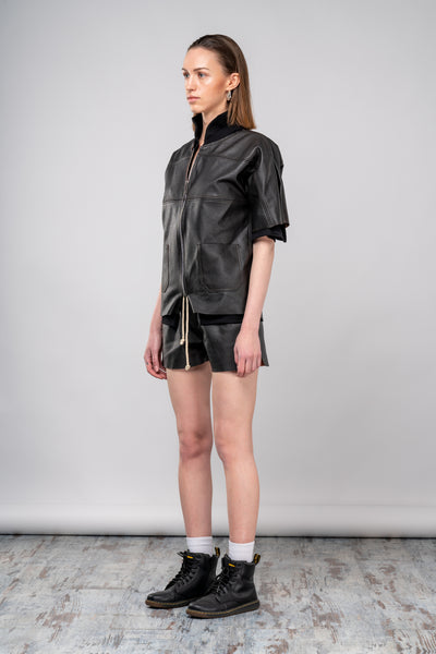Shop emerging dark conscious fashion genderless brand Anoir by Amal Kiran Jana Brown Surplus Leather Short Sleeve Bomber Jacket at Erebus