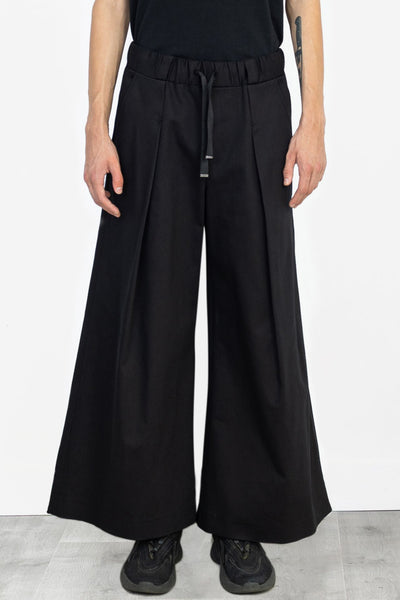 Shop Emerging Alternative Fashion Unisex Street Brand Monochrome AW22 Black Denim Hakama Trousers at Erebus