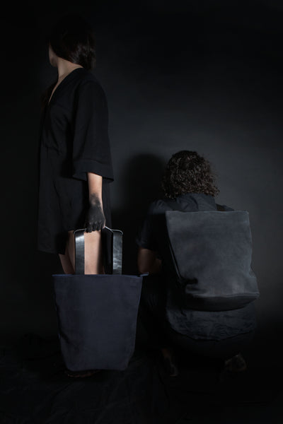 Shop Emerging Conscious Avant-garde Designer Brand MDK Miranda Kaloudis Black Nubuck Leather and Waxed Cotton Canvas Transformable Tesris Backpack Bag at Erebus